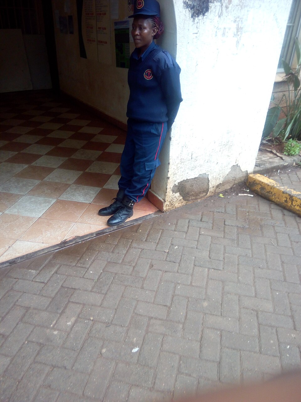 Security guard standing on duty at a property entrance
